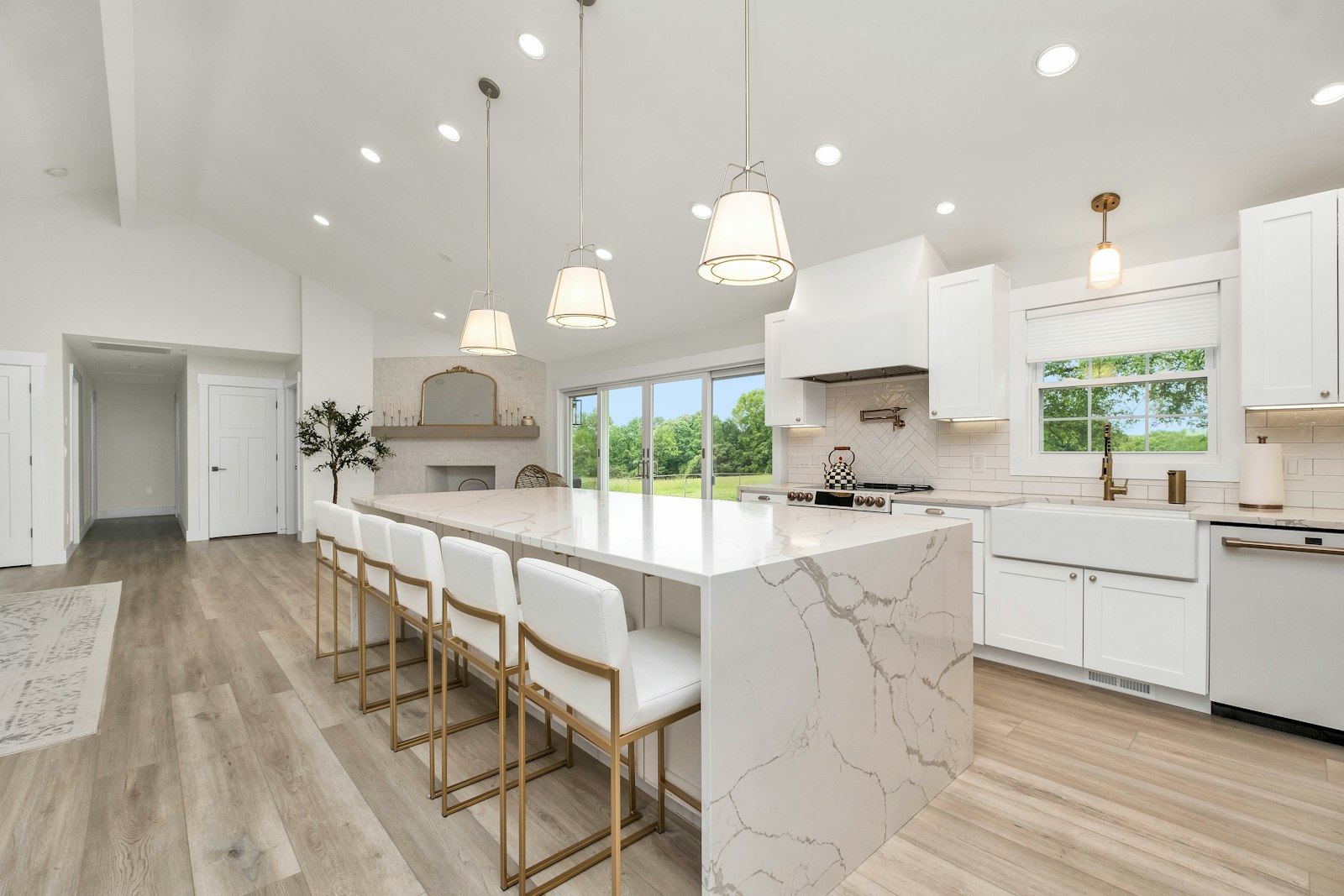 Custom quartz waterfall island kitchen